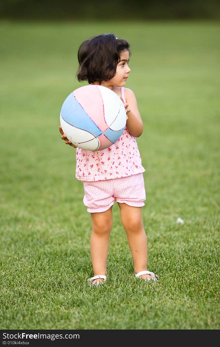 Child playing soccer in the backyard. Child playing soccer in the backyard