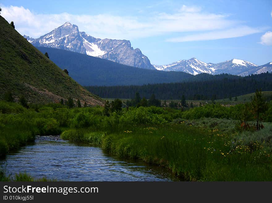 Stanley Creek as it flows through high mountain meadow,Sawtooth Mountains in background, Stanley Idaho. Stanley Creek as it flows through high mountain meadow,Sawtooth Mountains in background, Stanley Idaho