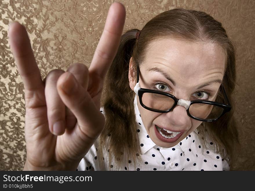 Cute Nerdy Girl Making Bull Horns Gesture