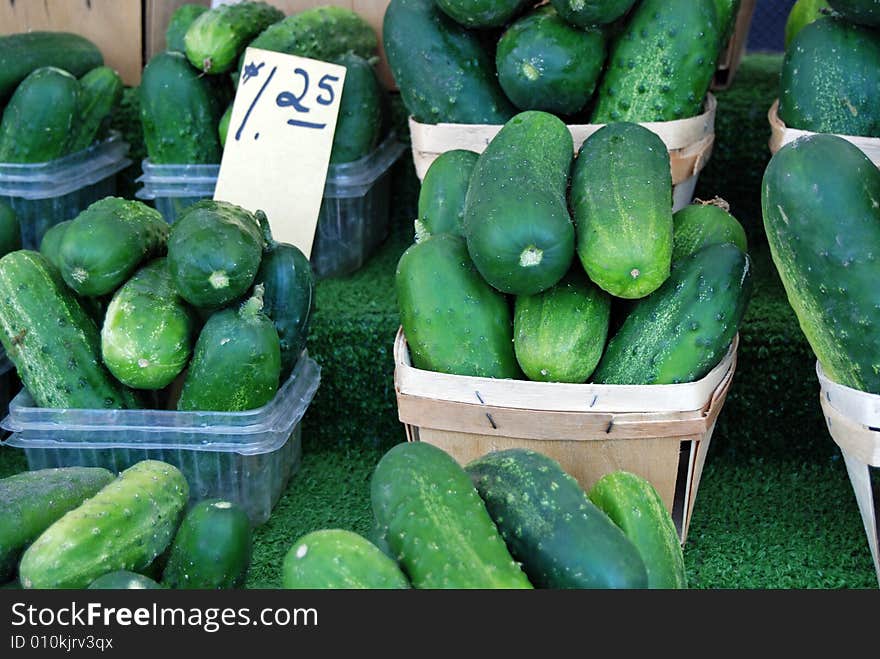 Fresh cucumbers being sold at the farmer's market. Fresh cucumbers being sold at the farmer's market.