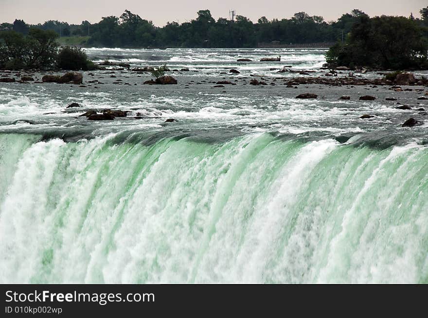 The strong rapids of the Horseshoe Falls. Horseshoe Falls is one of the great Niagara Falls. The strong rapids of the Horseshoe Falls. Horseshoe Falls is one of the great Niagara Falls.