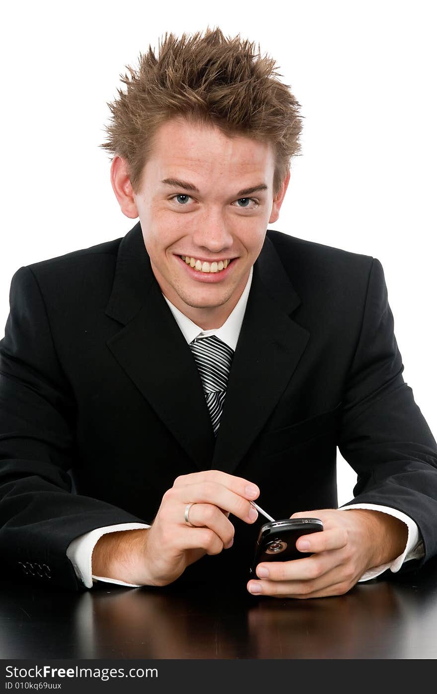 A young businessman on the phone in his office