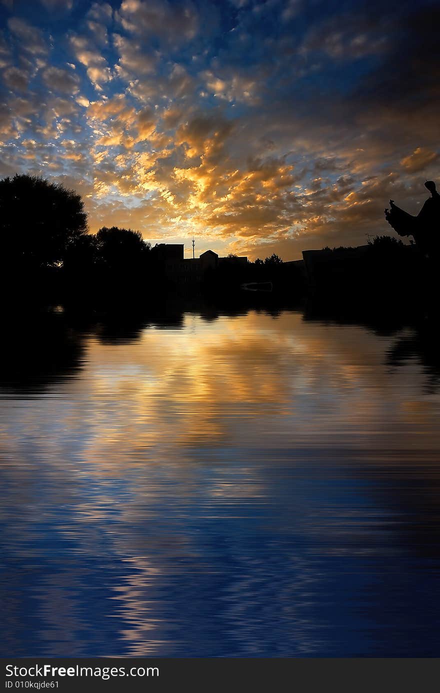 Orange color morning cloud on reflected water surface. Orange color morning cloud on reflected water surface