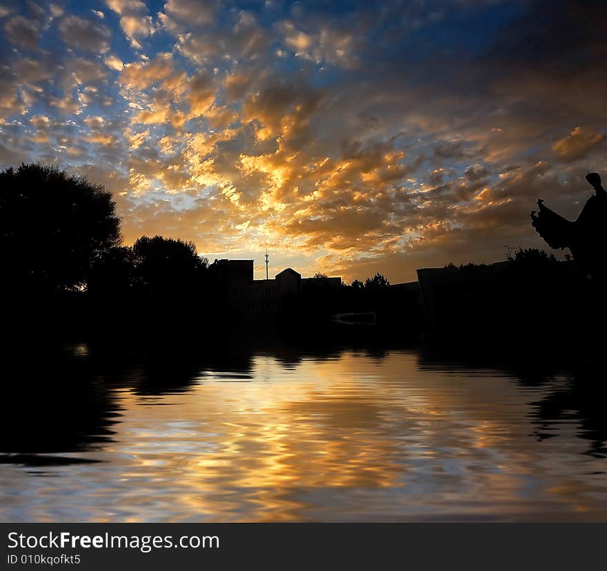 Orange sunrise on reflected water surface. Orange sunrise on reflected water surface