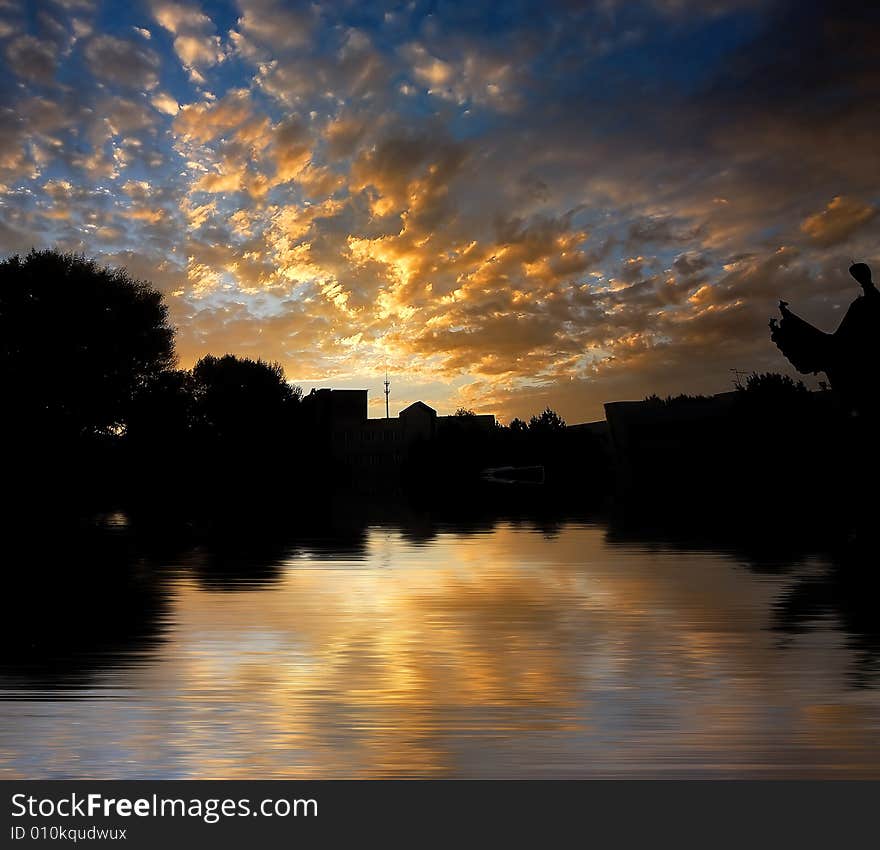 Orange color morning cloud on reflected water surface. Orange color morning cloud on reflected water surface