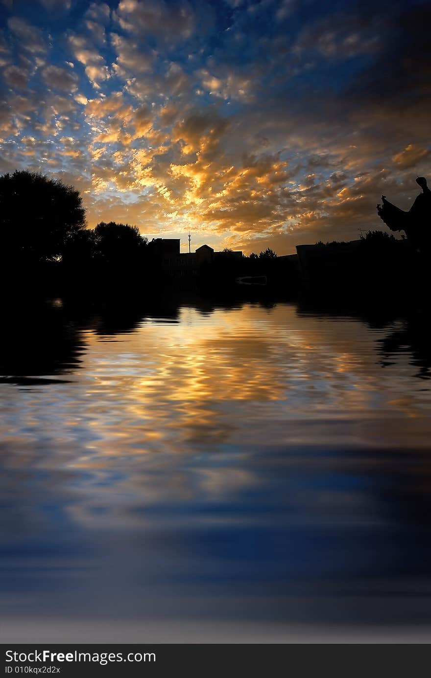 Orange sunrise on reflected water surface. Orange sunrise on reflected water surface