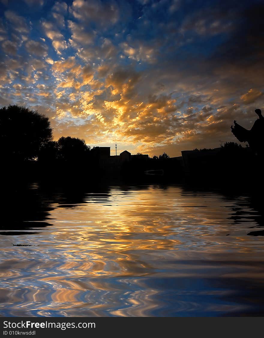 Orange sunrise on reflected water surface. Orange sunrise on reflected water surface