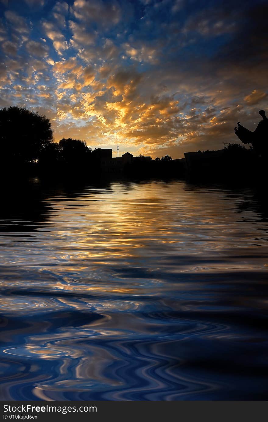 Orange sunrise on reflected water surface. Orange sunrise on reflected water surface