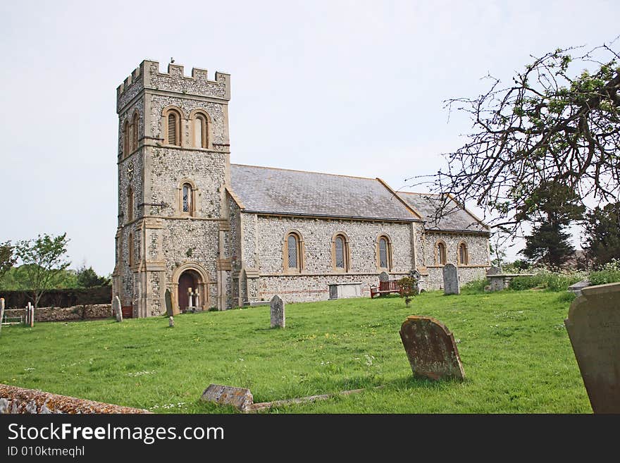 A village church from a view across the graveyard