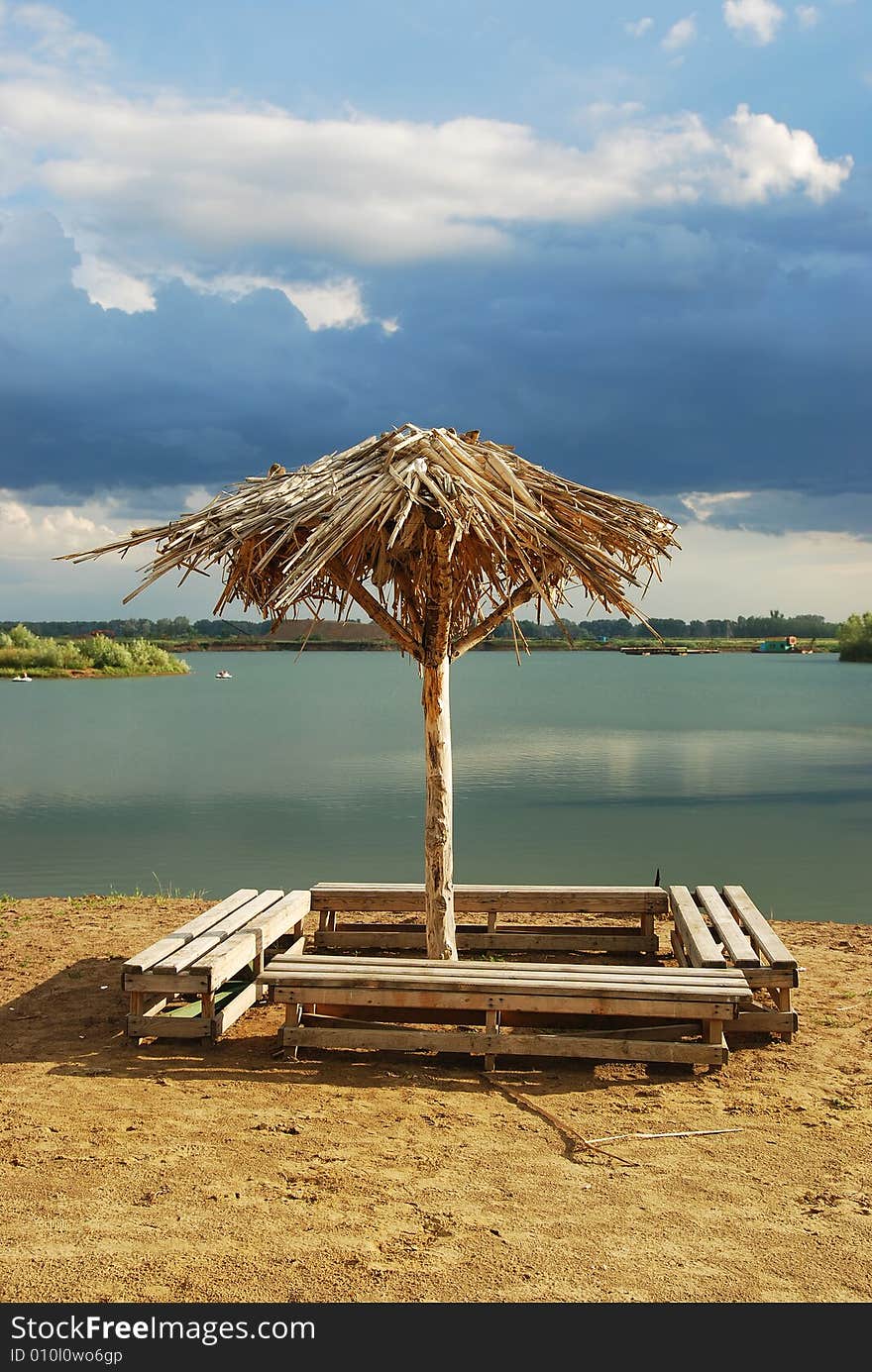 Lonely umbrella on empty beach