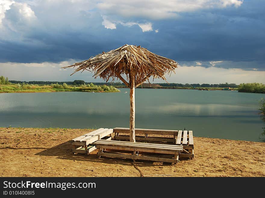 Lonely umbrella on empty beach