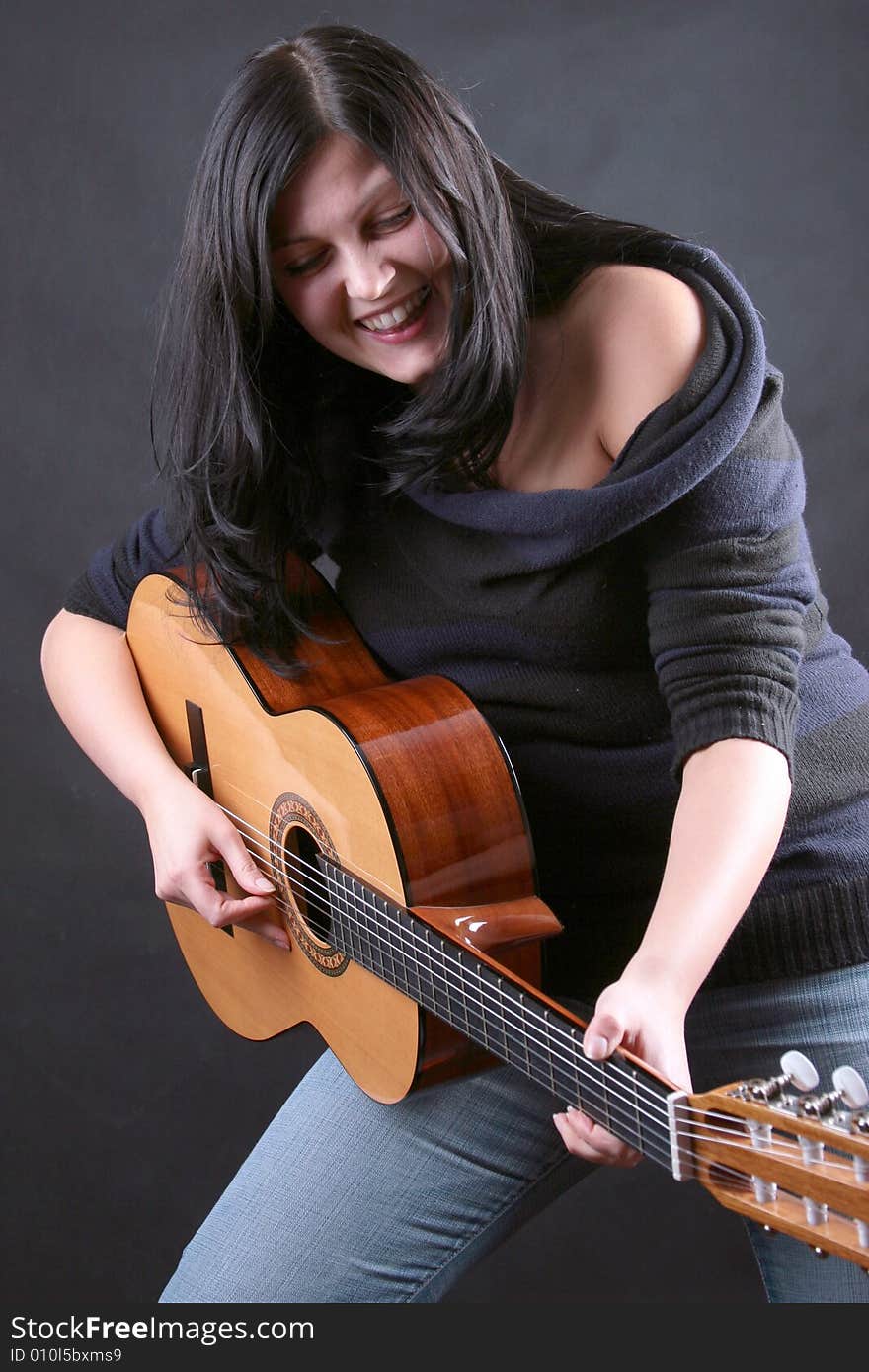 Photo of attractive brunette with guitar. Photo of attractive brunette with guitar