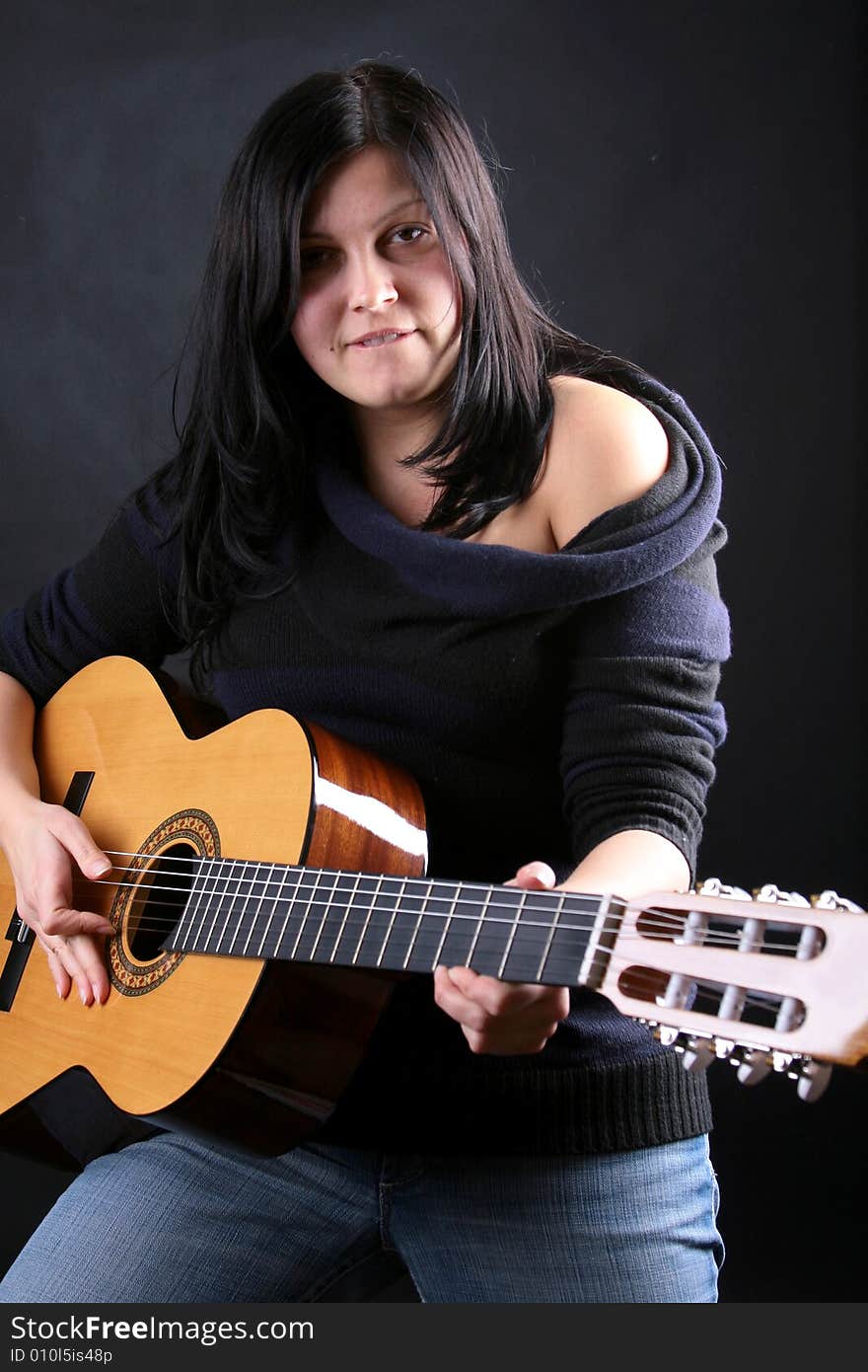 Photo of attractive brunette with guitar. Photo of attractive brunette with guitar