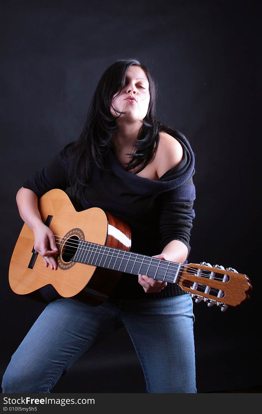 Photo of attractive brunette with guitar. Photo of attractive brunette with guitar