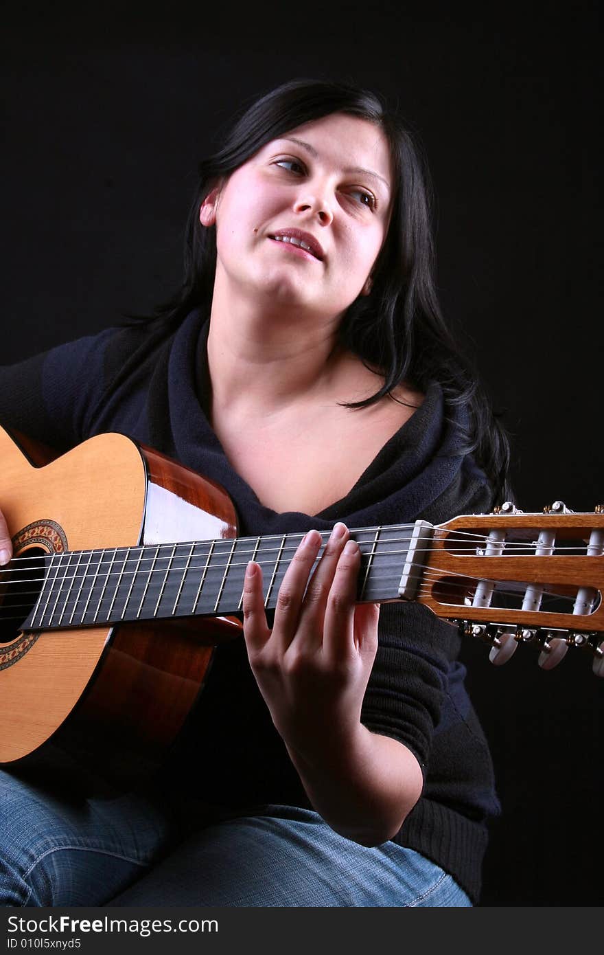 Photo of attractive brunette with guitar. Photo of attractive brunette with guitar