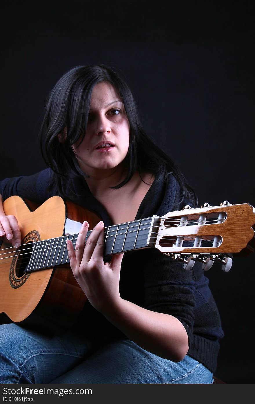 Photo of attractive brunette with guitar. Photo of attractive brunette with guitar