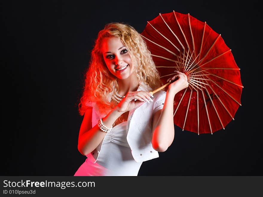 Portrait of young beauty woman in white dress at black background with umbrella. Portrait of young beauty woman in white dress at black background with umbrella