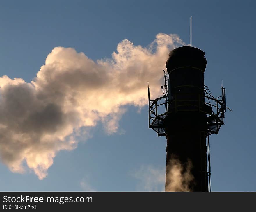 Smoke from factory tube on the blue sky. Smoke from factory tube on the blue sky.