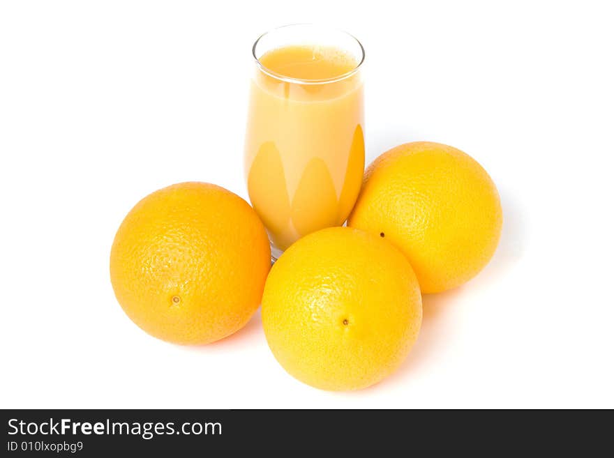 Three oranges and orange juice in the glass isolated on white. Three oranges and orange juice in the glass isolated on white