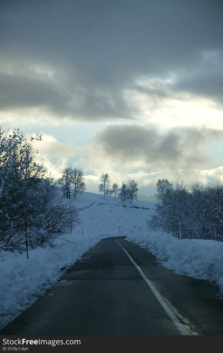 A snowy winter scene with snowplough. A snowy winter scene with snowplough