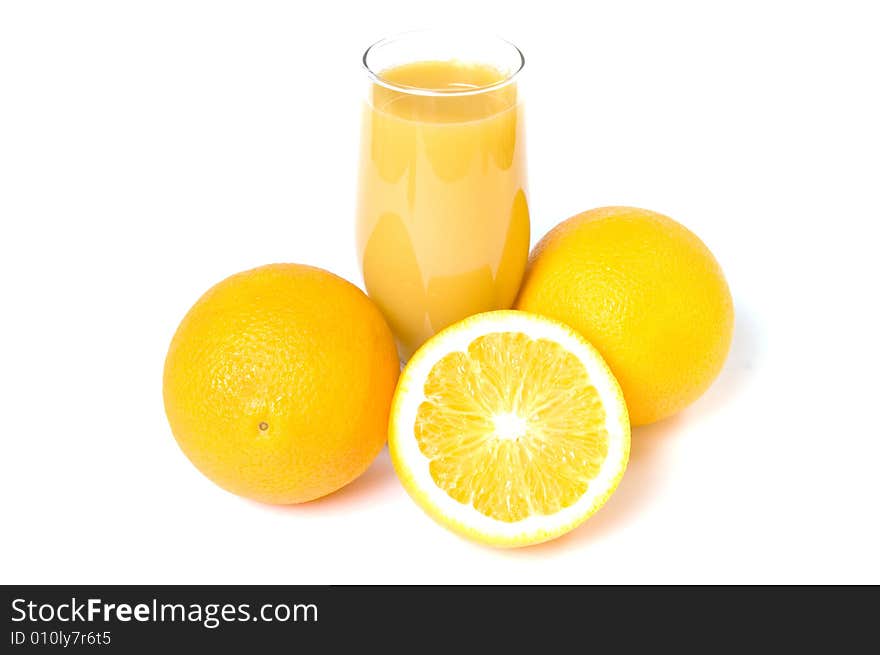 Three oranges and orange juice in the glass isolated on white. Three oranges and orange juice in the glass isolated on white