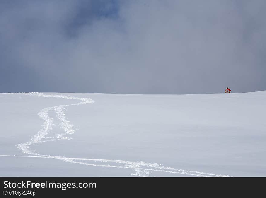 A snowy winter scene with skier. A snowy winter scene with skier