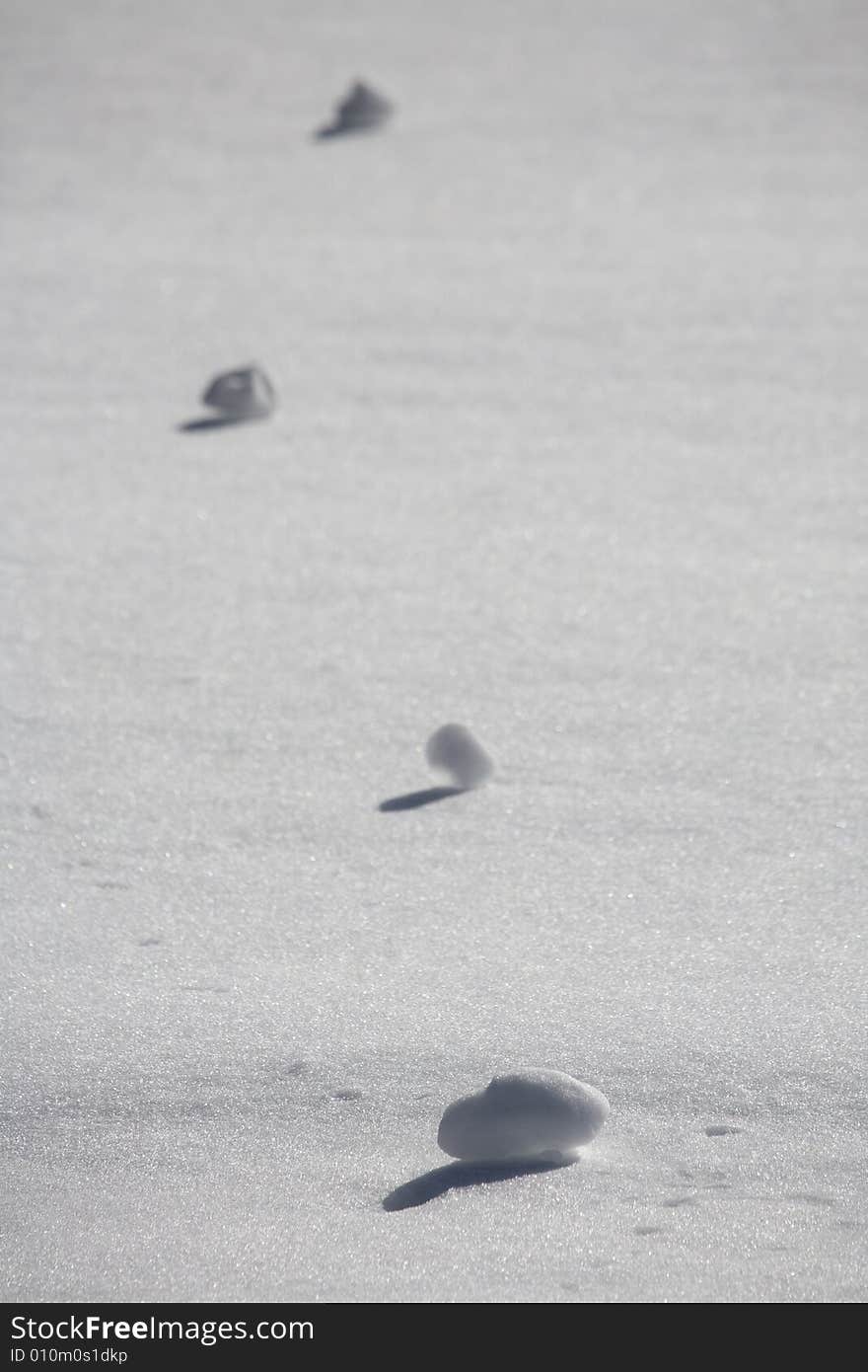 A snowy winter scene with snowballs. A snowy winter scene with snowballs