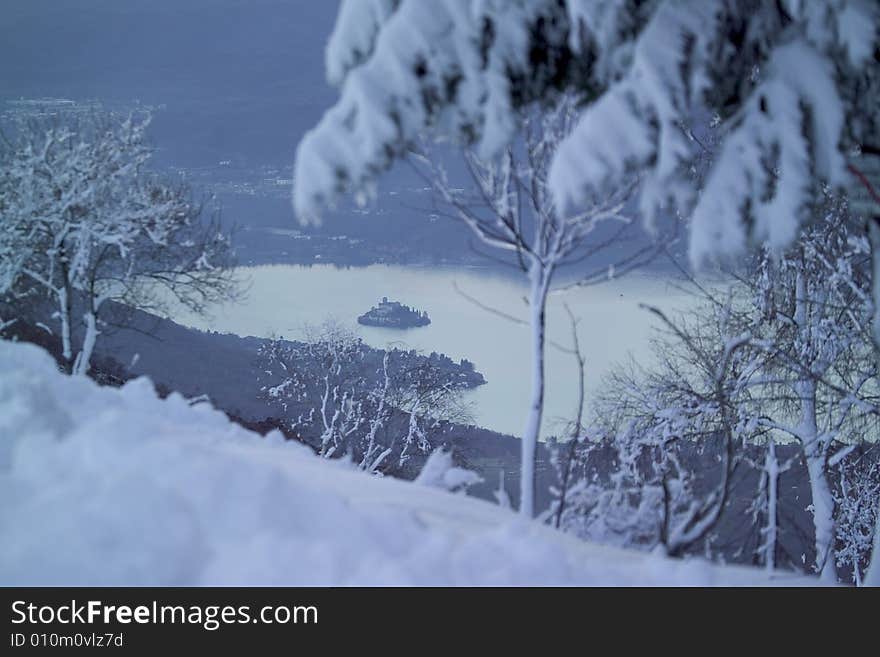 A snowy winter landscapes with lake. A snowy winter landscapes with lake