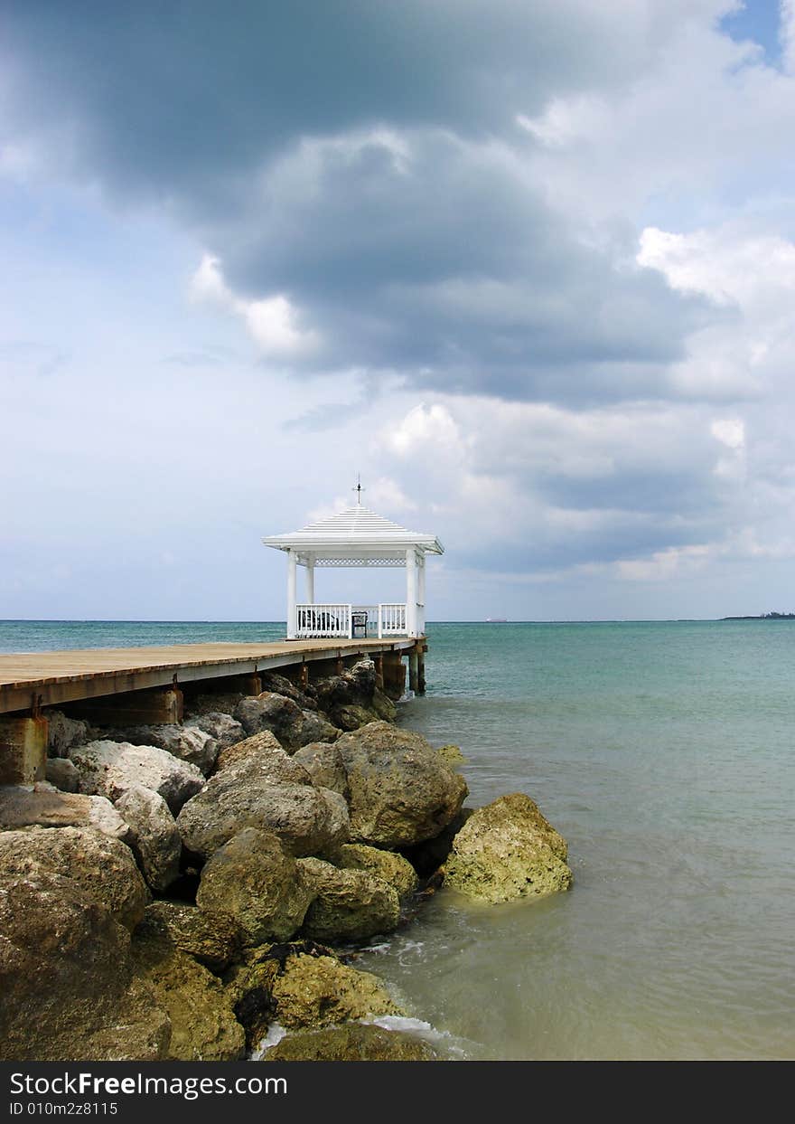 The empty gazebo with dark clouds over it in Nassau town, The Bahamas.