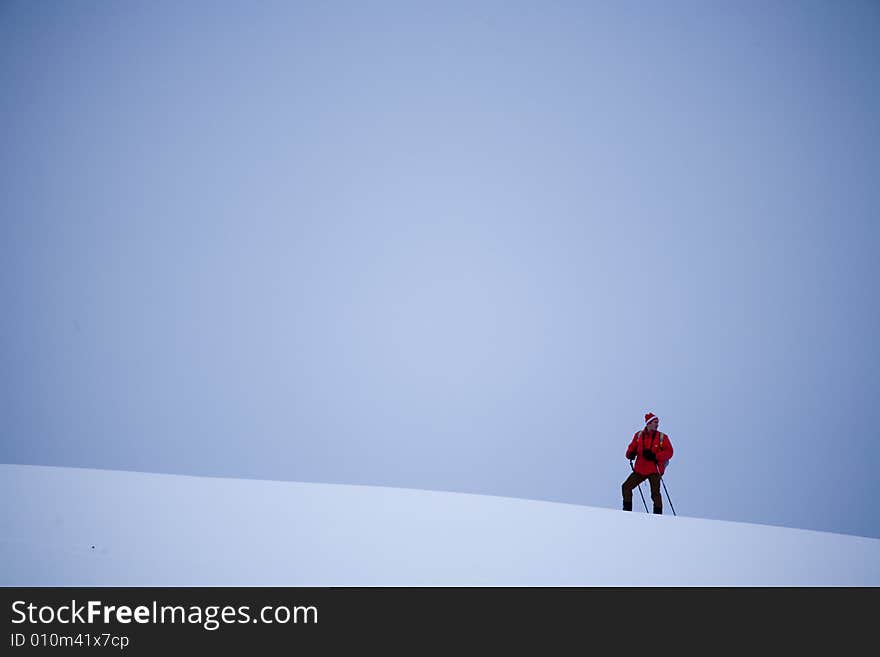 A snowy winter scene with skier. A snowy winter scene with skier