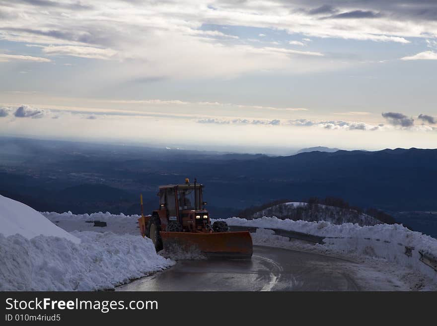 A snowy winter scene with snowplough. A snowy winter scene with snowplough