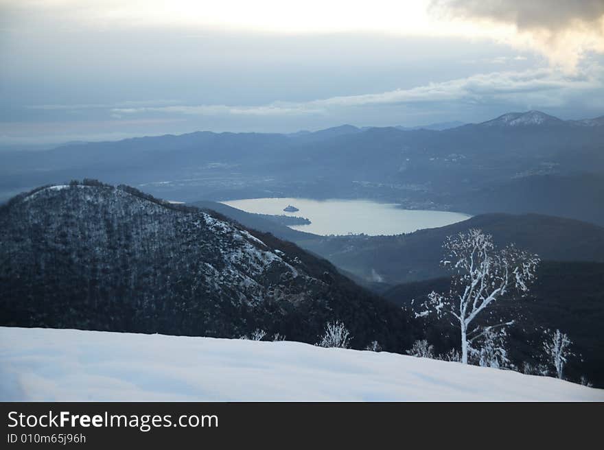 A snowy winter landscapes with lake. A snowy winter landscapes with lake