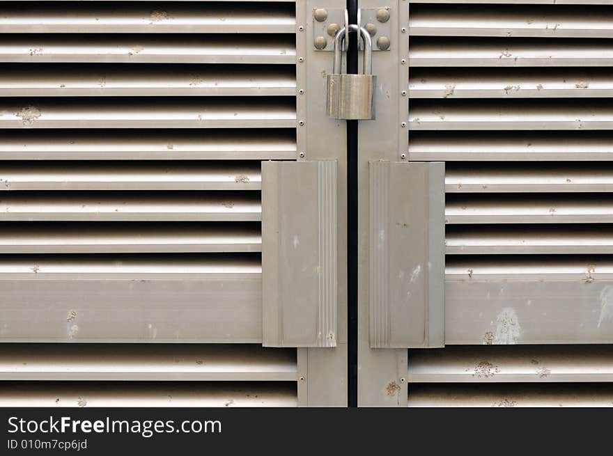 Locks on a gate meant to keep outsiders out. Locks on a gate meant to keep outsiders out