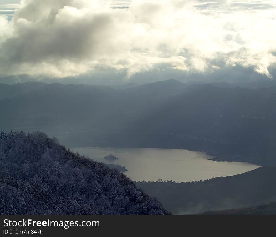 A snowy winter scene with lake. A snowy winter scene with lake