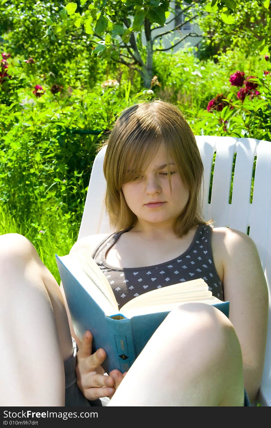 The young attractive student with the book. The young attractive student with the book