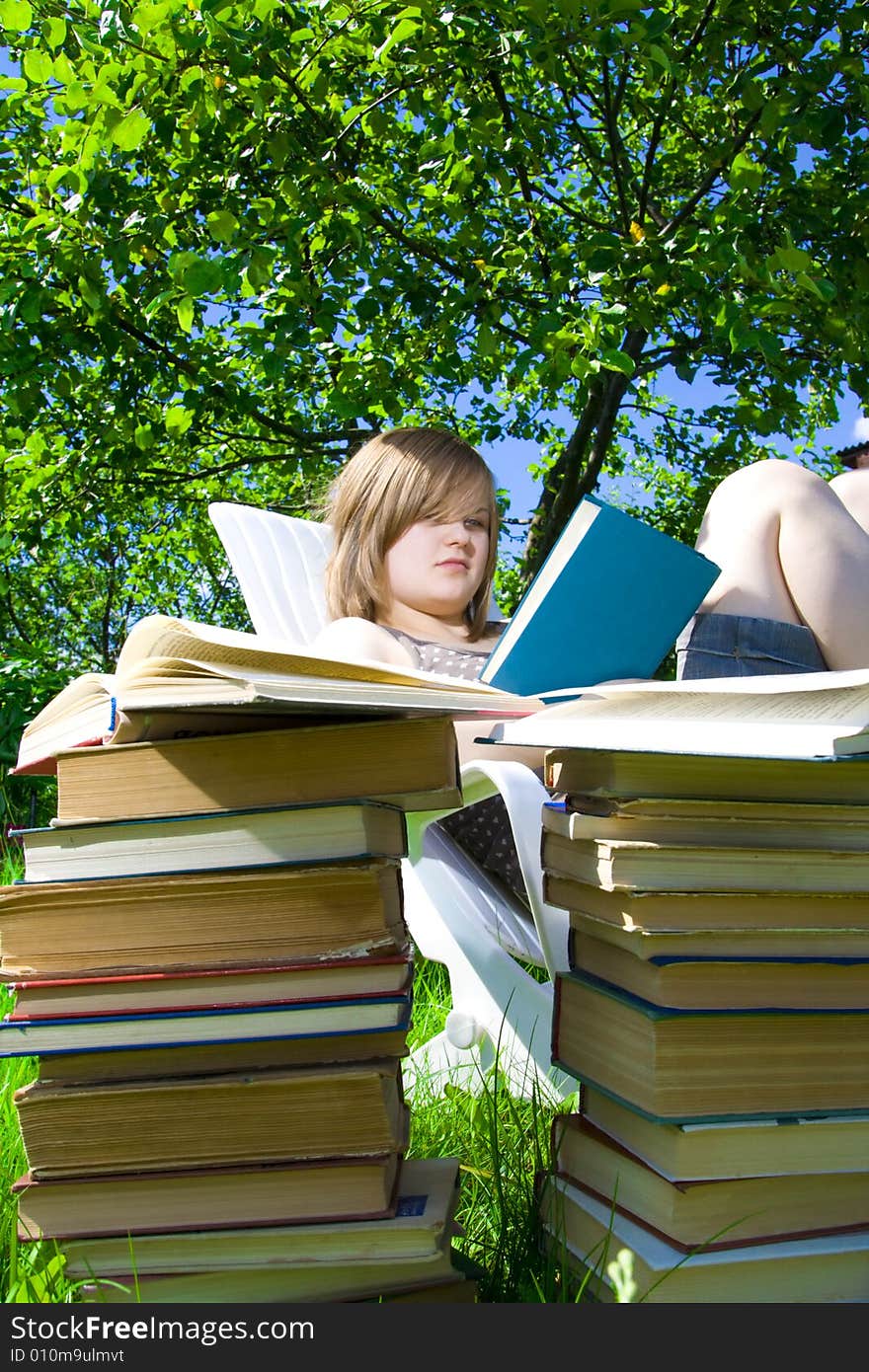 The young attractive student with the books. The young attractive student with the books