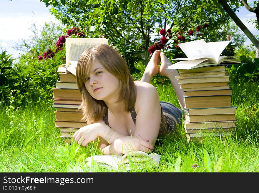 The young attractive student with the books. The young attractive student with the books