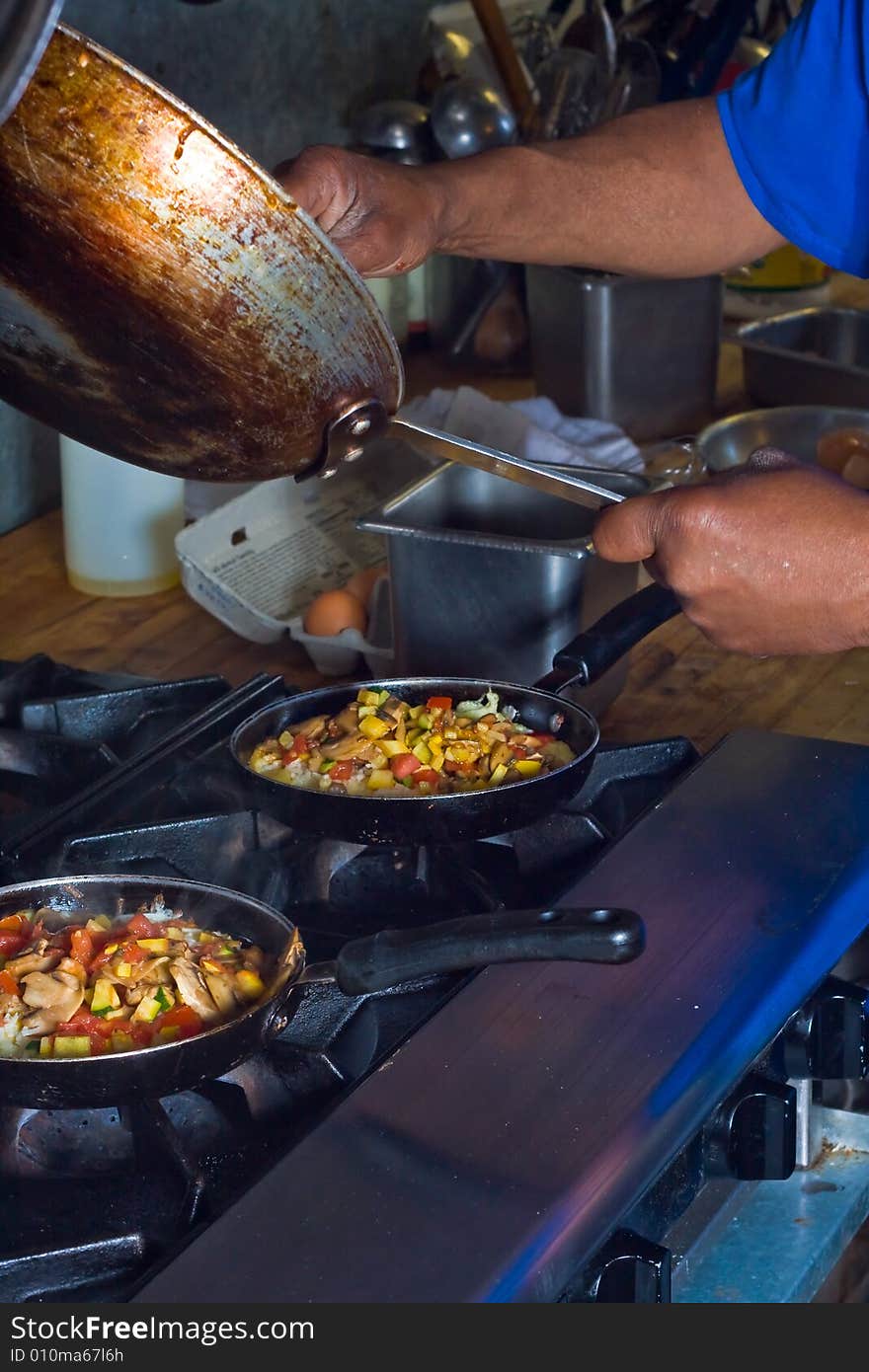 2 pans on cook stove,. 2 pans on cook stove,