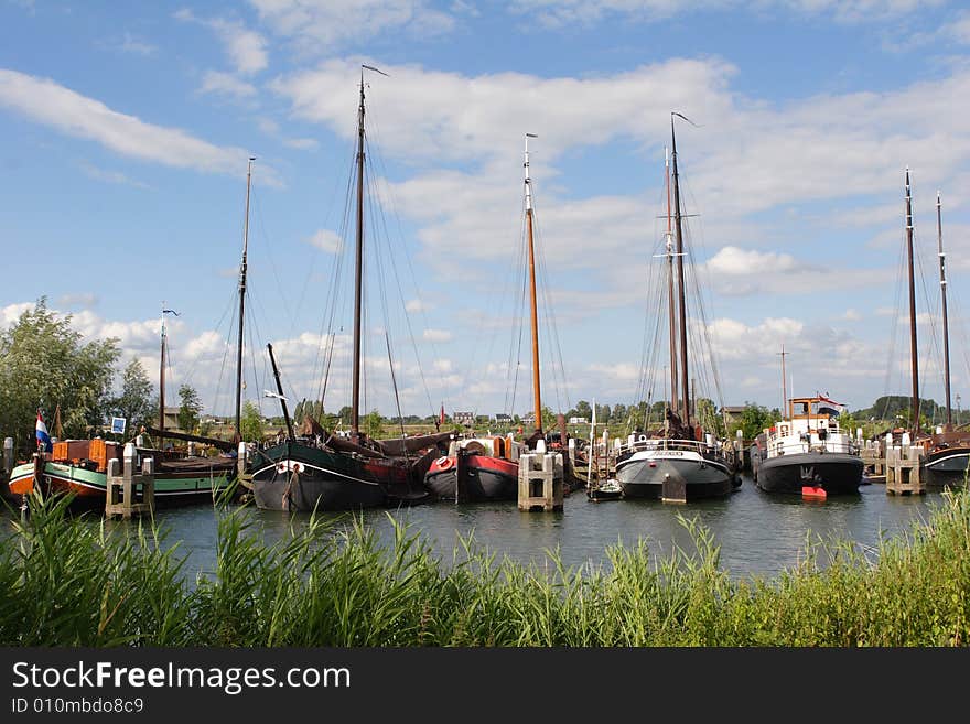 Flatbottom sailboats in the harbor of Holland