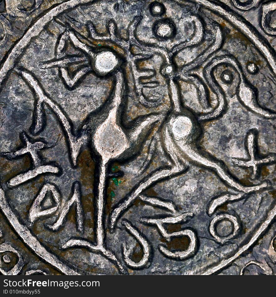 Closeup of lion minted on silver rupee from independent kingdom of Tripura, Rajadhara Manikya (1586-1599). Closeup of lion minted on silver rupee from independent kingdom of Tripura, Rajadhara Manikya (1586-1599)