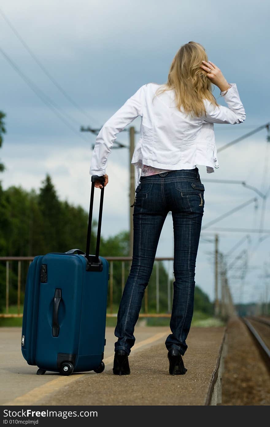 Young lady waiting a train