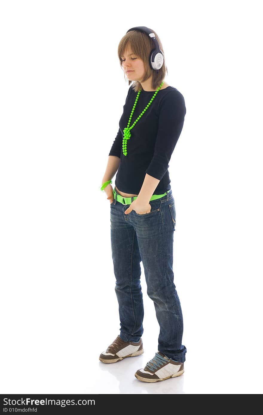 The young girl with a headphones isolated on a white background