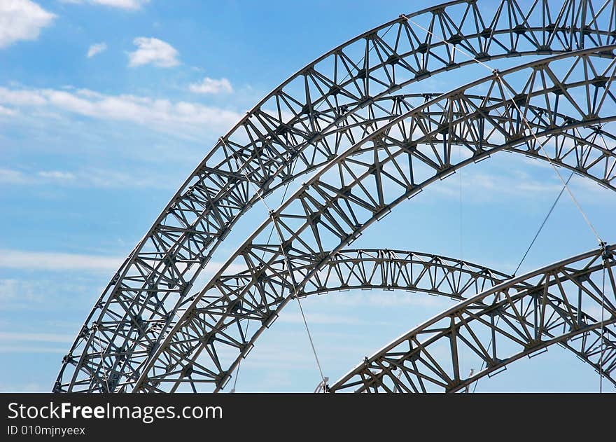 Futuristic construction over sky background