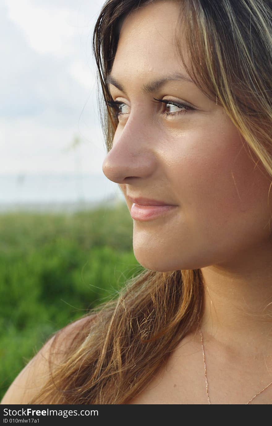 Young female glancing towards the side. Young female glancing towards the side