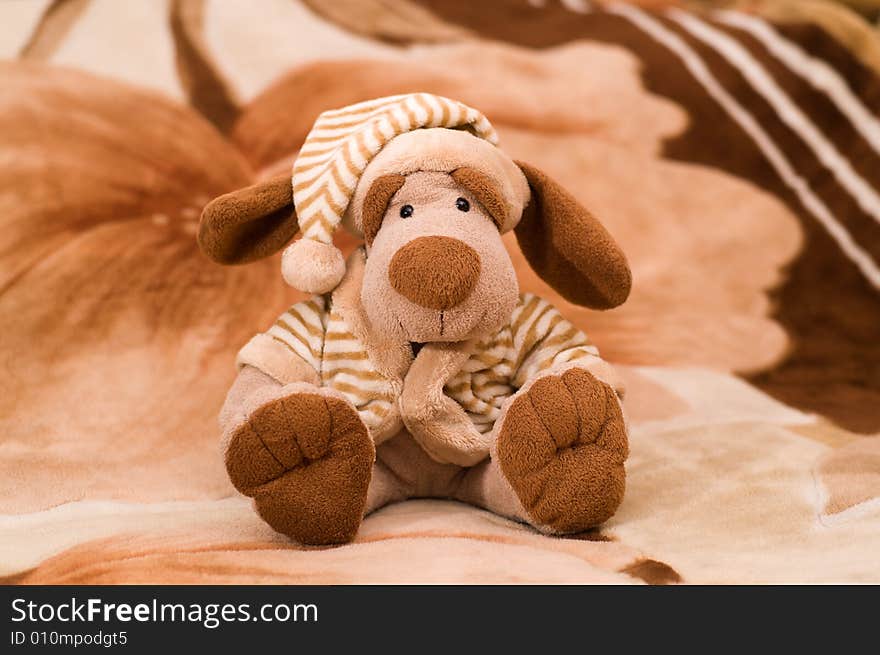 Dog toy is sitting on the carpet. Dog toy is sitting on the carpet