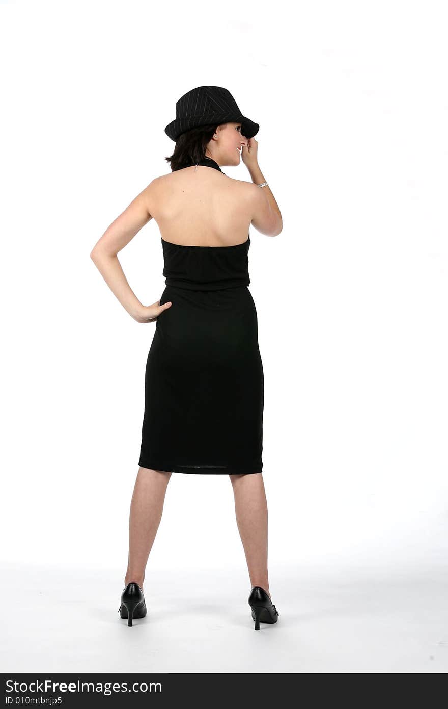 Back view of teen wearing black dress and top hat