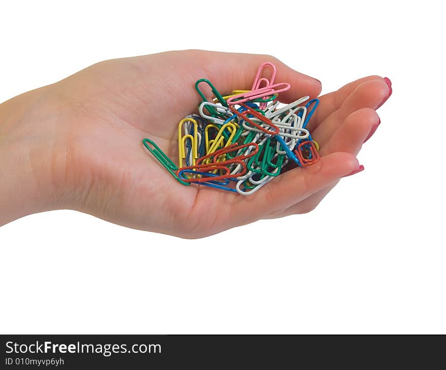 Paper clip in hand isolated on white background