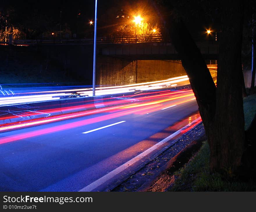 Long exposure picture of a highway at night.