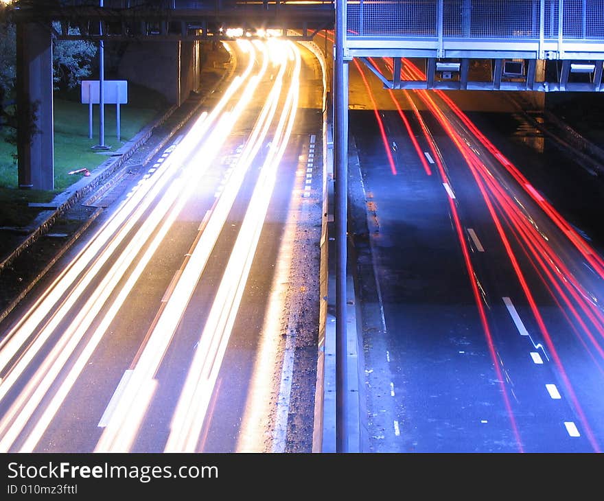 Long exposure picture of a highway at night.