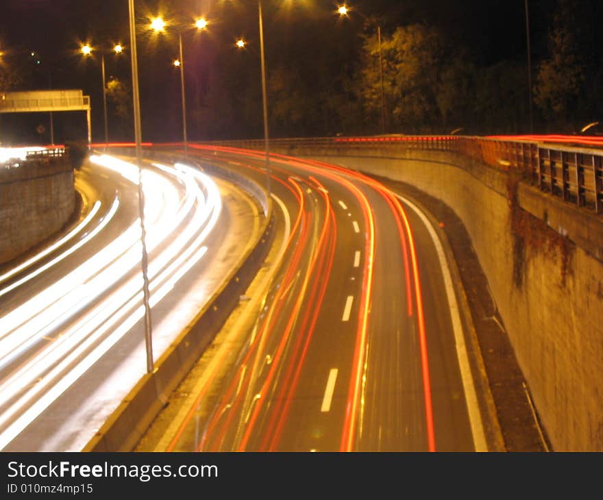 Long exposure picture of a highway at night.